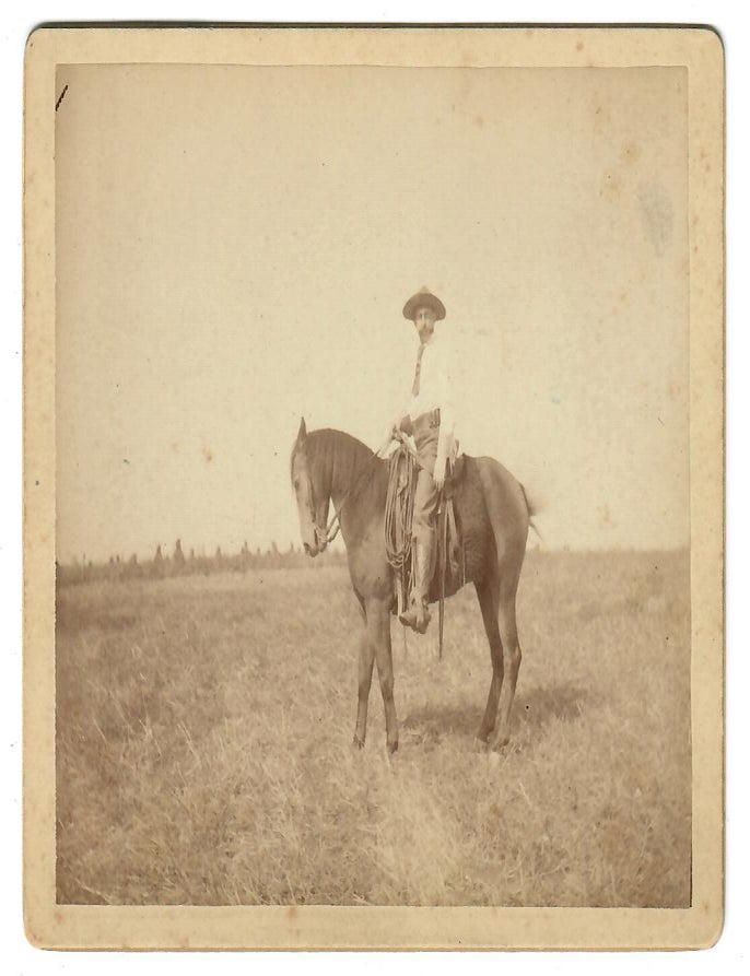 Item #32070 [Cowboy on Range with Native American Tepees]. No named photographer.