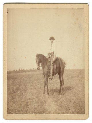 Item #32070 [Cowboy on Range with Native American Tepees]. No named photographer